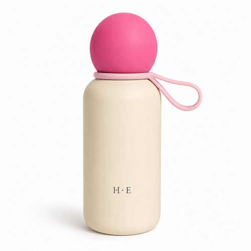 Rosen Pebble Bottle: pink ball lid with matching pink carry loop on cream body, white background
